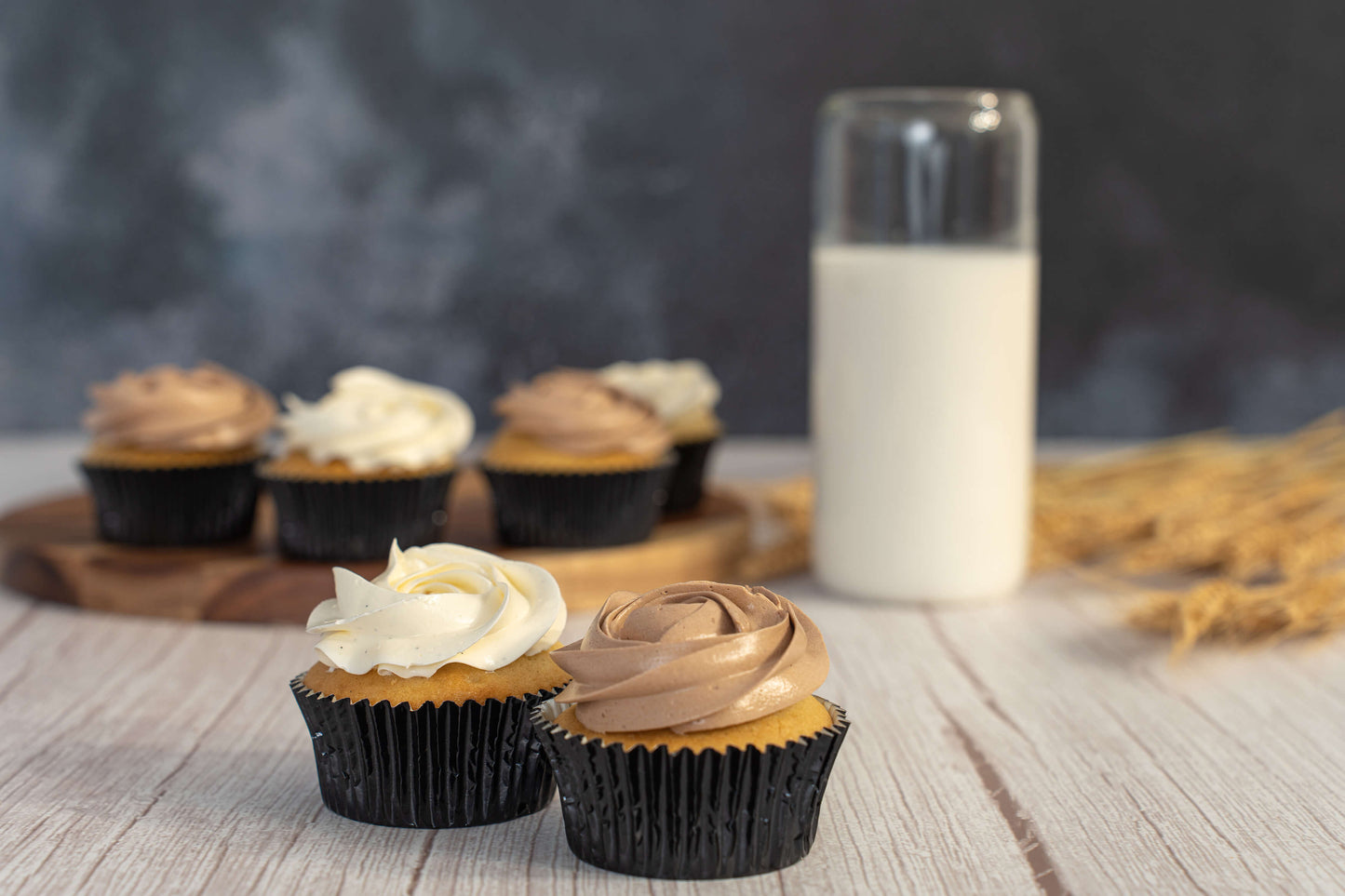 cupcakes with italian meringue buttercream on a table