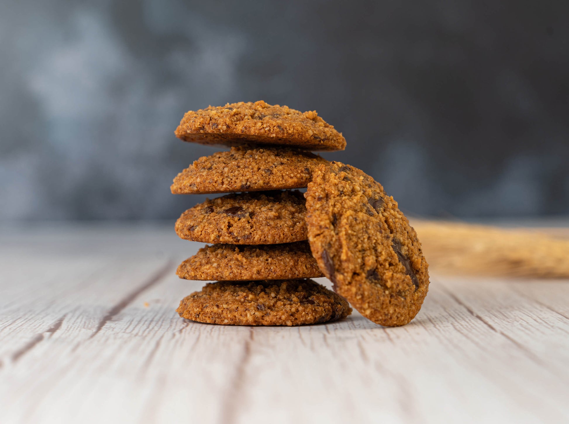 keto chocolate chip cookies stacked on a table